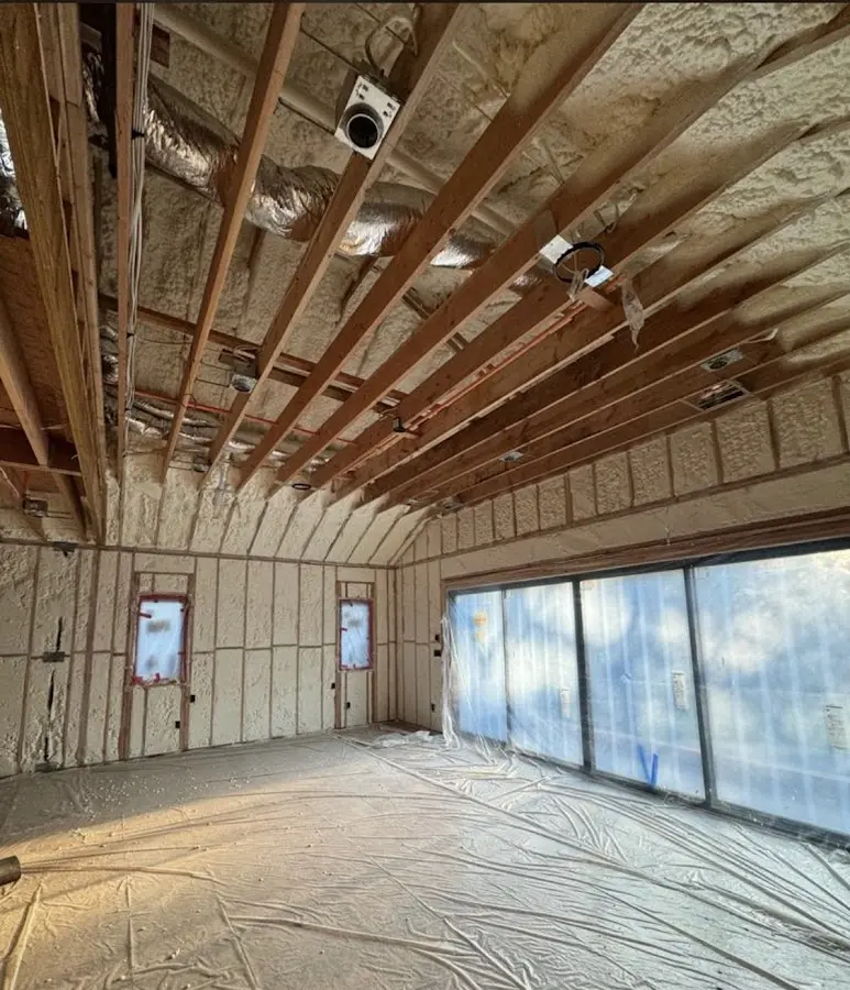 Interior walls and ceiling insulated with spray foam during new construction in Sutton